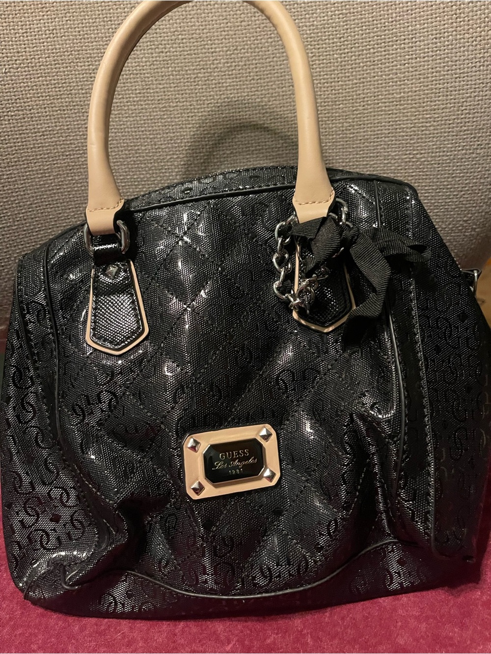 GUESS Black Patent Satchel with Beige Handles and Gold Plaque Accent